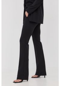 Hugo - HUGO spodnie damskie kolor czarny dzwony high waist. Stan: podwyższony. Kolor: czarny. Materiał: dzianina. Wzór: gładki