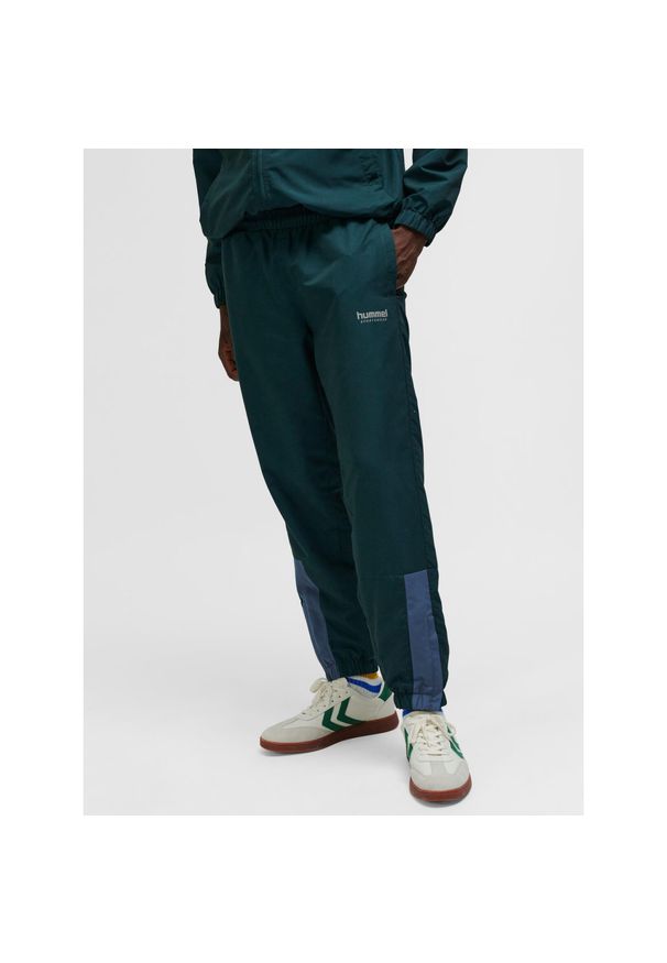 Spodnie dresowe Hummel hmlTRACKSUIT. Kolor: zielony. Materiał: dresówka. Sport: fitness
