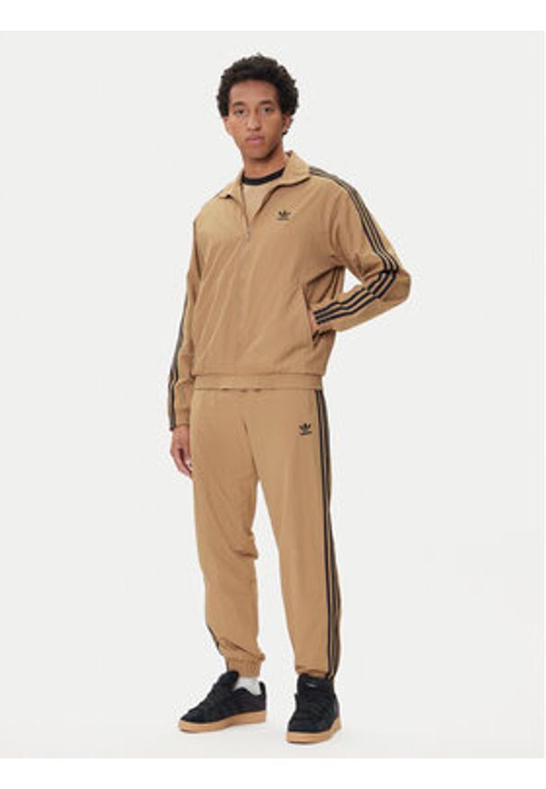 Adidas - adidas Bluza adicolor Woven Firebird JY1333 Beżowy Loose Fit. Kolor: beżowy. Materiał: syntetyk