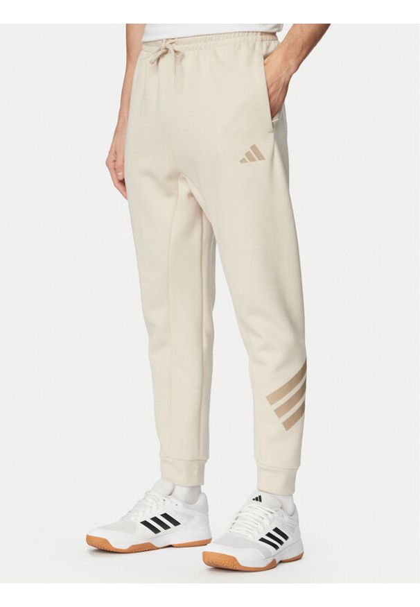 Adidas - adidas Spodnie dresowe Future Icons 3-Stripes KD5206 Beżowy Regular Fit. Kolor: beżowy. Materiał: syntetyk, bawełna
