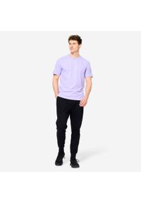 DOMYOS - Spodnie fitness męskie Domyos Gym & Pilates slim. Kolor: czarny. Materiał: dresówka, materiał, dzianina. Wzór: ze splotem. Sport: joga i pilates, fitness