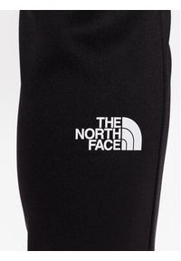 The North Face Spodnie dresowe Reaxion NF0A7ZAB Czarny Regular Fit. Kolor: czarny. Materiał: syntetyk