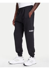 Adidas - adidas Spodnie dresowe Essentials Linear Fleece JN1786 Czarny Regular Fit. Kolor: czarny. Materiał: bawełna