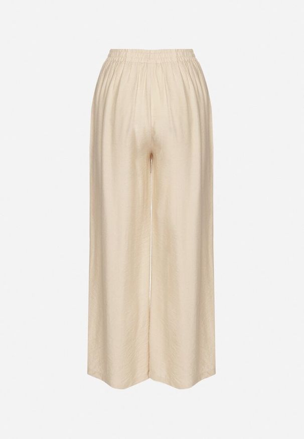 Born2be - Beżowe Szerokie Spodnie z Wysokim Stanem Ozdobione Sznurkiem Fenaris. Okazja: na spacer. Stan: podwyższony. Kolor: beżowy. Długość: długie. Wzór: aplikacja. Sezon: lato. Styl: elegancki, klasyczny