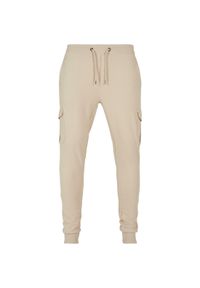 Spodnie dresowe Urban Classics Fitted Cargo GT. Kolor: beżowy. Materiał: dresówka #1