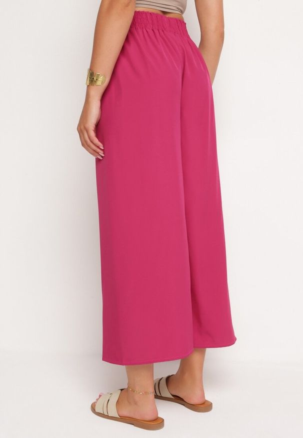 Born2be - Ciemnofioletowe Szerokie Spodnie z Wysokim Stanem Wiskozą i Gumką w Pasie Criseldas. Okazja: do pracy, na co dzień, na spotkanie biznesowe. Stan: podwyższony. Kolor: fioletowy. Materiał: wiskoza. Długość: długie. Styl: elegancki, biznesowy, casual