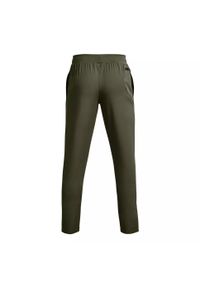 Spodnie dresowe męskie Under Armour UNSTOPPABLE TAPERED PANTS. Kolor: zielony. Materiał: dresówka. Długość: długie