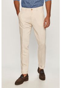 Marciano Guess - Spodnie. Kolor: beżowy. Materiał: tkanina. Wzór: gładki