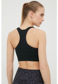Calvin Klein Performance biustonosz sportowy Seamless kolor czarny gładki. Kolor: czarny. Materiał: skóra, materiał. Rodzaj stanika: wyciągane miseczki. Wzór: gładki. Sport: fitness, taniec #4