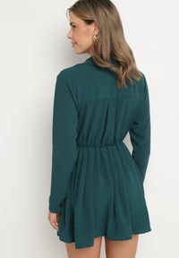 Born2be - Ciemnozielona Asymetryczna Sukienka o Koszulowym Kroju z Gumką w Talii Elodina. Kolor: zielony. Długość rękawa: długi rękaw. Typ sukienki: koszulowe, asymetryczne. Styl: elegancki, sportowy #6