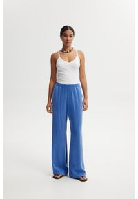 SPODNIE LEXI NIEBIESKIE XL - Flawless. Okazja: na co dzień. Stan: podwyższony. Kolor: niebieski. Materiał: materiał. Styl: elegancki, casual, wizytowy #1