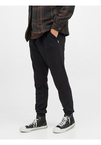 Jack & Jones - Jack&Jones Spodnie dresowe Gordon 12249274 Czarny Regular Fit. Kolor: czarny. Materiał: bawełna