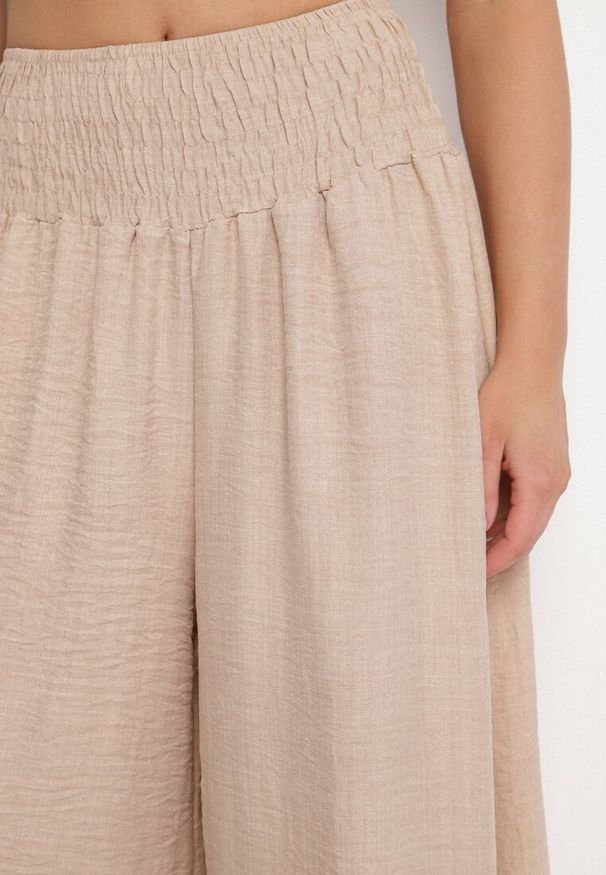 Born2be - Beżowe Spodnie Szerokie z Szeroką Gumką w Talii Koririelle. Okazja: na co dzień. Kolor: beżowy. Styl: elegancki, casual