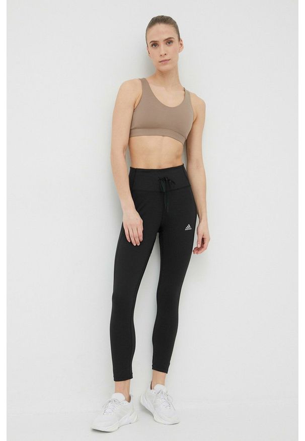 Adidas - adidas legginsy do biegania Running Essentials damskie kolor czarny gładkie. Kolor: czarny. Materiał: materiał, skóra, dzianina. Wzór: gładki. Sport: bieganie
