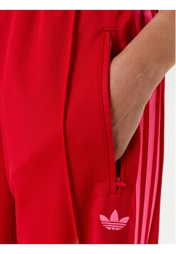 Adidas - adidas Spodnie dresowe adicolor Classic Firebird JW1225 Czerwony Loose Fit. Kolor: czerwony. Materiał: syntetyk
