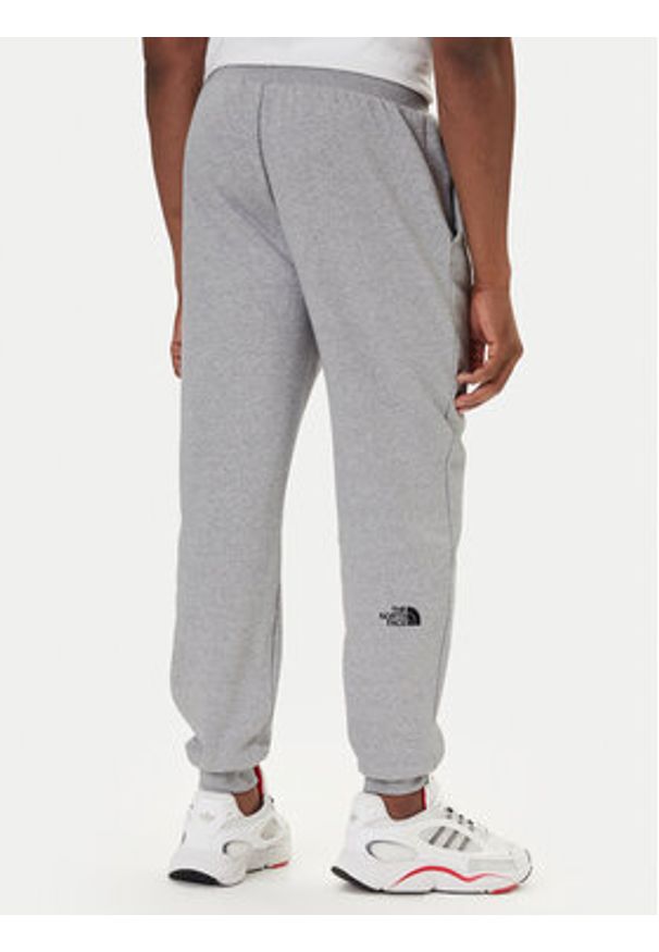The North Face Spodnie dresowe Fine NF0A8C1K Szary Tapered Fit. Kolor: szary. Materiał: bawełna