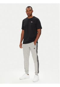 Adidas - adidas Spodnie dresowe adicolor 3-Stripes JY1387 Szary Slim Fit. Kolor: szary. Materiał: bawełna