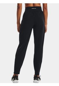 Spodnie dresowe damskie Under Armour OutRun the STORM Pant. Kolor: czarny. Materiał: dresówka. Sport: fitness