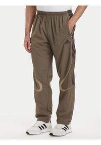 Adidas - adidas Spodnie dresowe adicolor Teamgeist KD5865 Khaki Loose Fit. Kolor: brązowy. Materiał: syntetyk #1