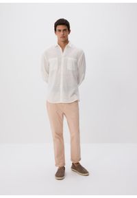 Reserved - Bawełniane spodnie chino slim - różowy. Kolor: różowy. Materiał: bawełna