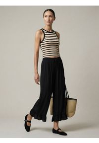 Sinsay - Spodnie z falbankami i wiskozą - czarny. Kolor: czarny. Materiał: wiskoza #1