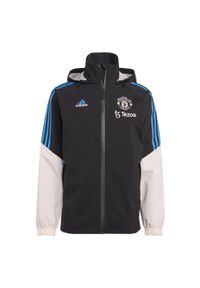 Kurtka do piłki nożnej męska Adidas Manchester United Condivo 22 Storm. Kolor: wielokolorowy, różowy, czarny. Materiał: materiał