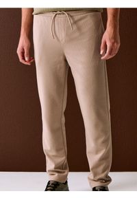 Sinsay - Spodnie dresowe jogger ottoman - beżowy. Kolor: beżowy. Materiał: dresówka #1