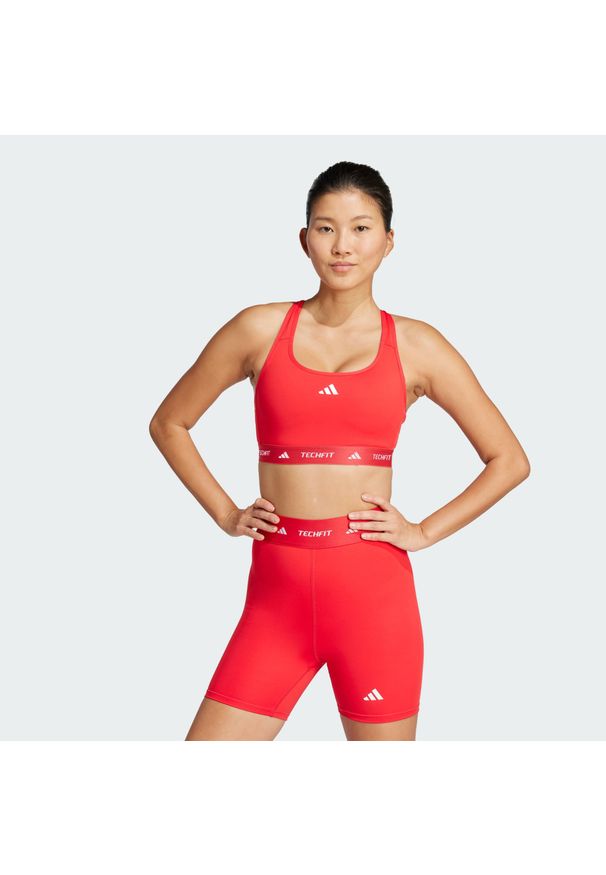 Adidas - Biustonosz TECHFIT. Kolor: czerwony. Materiał: materiał. Technologia: Techfit (Adidas). Sport: fitness