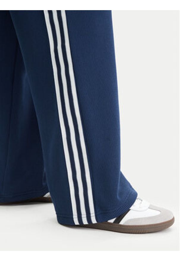 Adidas - adidas Spodnie dresowe adicolor Firebird JV7524 Granatowy Regular Fit. Kolor: niebieski. Materiał: syntetyk