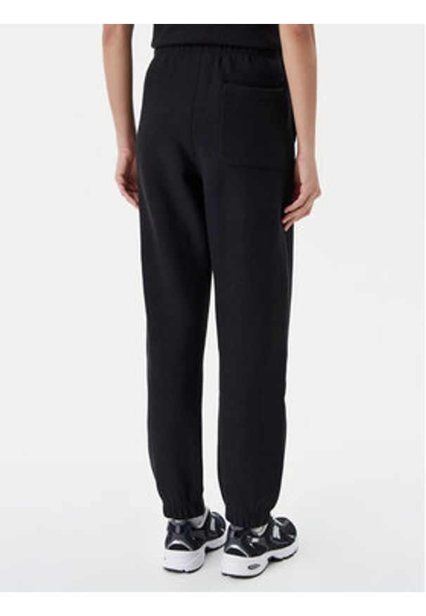 Champion Spodnie dresowe 117872 Czarny Slim Fit. Kolor: czarny. Materiał: bawełna