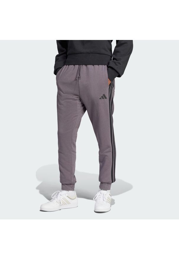 Adidas - Spodnie Essential 3-Stripes French Terry. Kolor: wielokolorowy, czarny, szary. Materiał: materiał