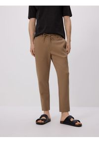 Reserved - Spodnie chino slim fit - beżowy. Kolor: beżowy. Materiał: bawełna, tkanina
