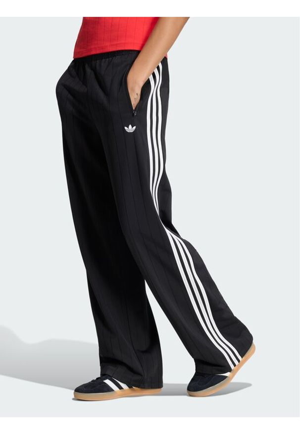Adidas - adidas Spodnie dresowe Pinstripe Firebird KS6787 Czarny Loose Fit. Kolor: czarny. Materiał: syntetyk