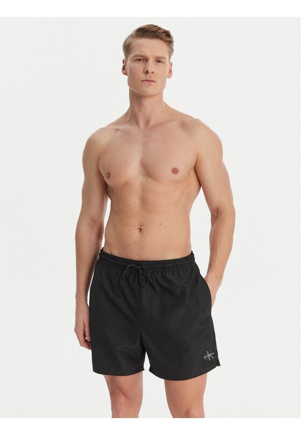 Calvin Klein Swimwear Szorty kąpielowe LV00N61045 Czarny Regular Fit. Kolor: czarny. Materiał: syntetyk