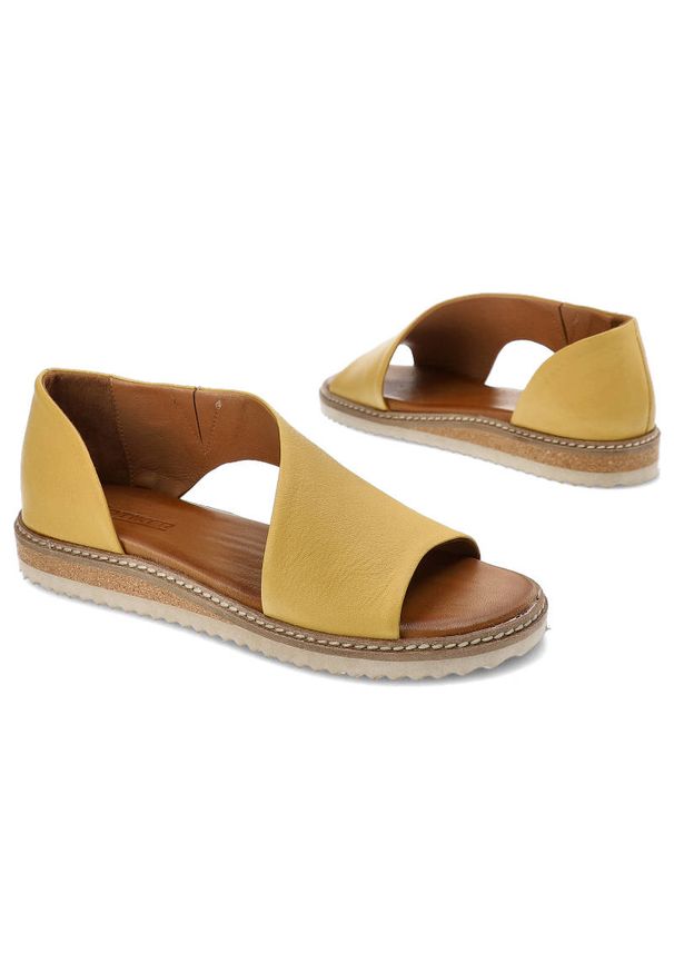 Sandały damskie Artiker, naturalna skóra licowa w żółtym kolorze z szerokimi paskami obejmującymi stopę oraz płaską podeszwą z dekoracyjnym obszyciem. Okazja: na co dzień, na spacer. Nosek buta: otwarty. Zapięcie: pasek. Kolor: żółty. Materiał: skóra. Sezon: lato. Obcas: na płaskiej podeszwie. Styl: casual, elegancki