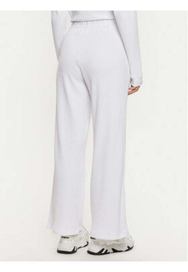 TOMMY HILFIGER - Tommy Hilfiger Spodnie dresowe UW0UW05577 Biały Relaxed Fit. Kolor: biały. Materiał: bawełna