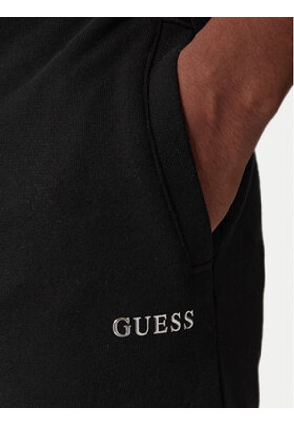 Guess Spodnie dresowe Z6RB12 KAIJ1 Czarny Regular Fit. Kolor: czarny. Materiał: bawełna