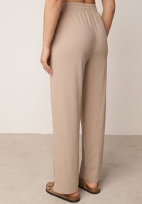 Born2be - Beżowe Szerokie Spodnie z Prążkowanej Tkaniny z Wysokim Stanem Sarora. Okazja: na co dzień. Stan: podwyższony. Kolor: beżowy. Materiał: tkanina, prążkowany. Wzór: prążki. Styl: casual #3