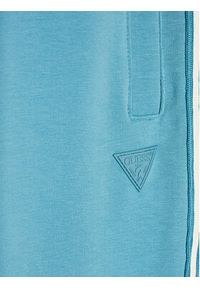 Guess Spodnie dresowe L2YQ48 K6ZS1 Niebieski Regular Fit. Kolor: niebieski. Materiał: bawełna #2