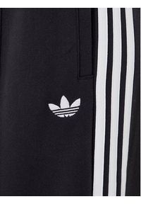 Adidas - adidas Spodnie dresowe adicolor 3-Stripes JV7473 Czarny Wide Leg. Kolor: czarny. Materiał: bawełna #4