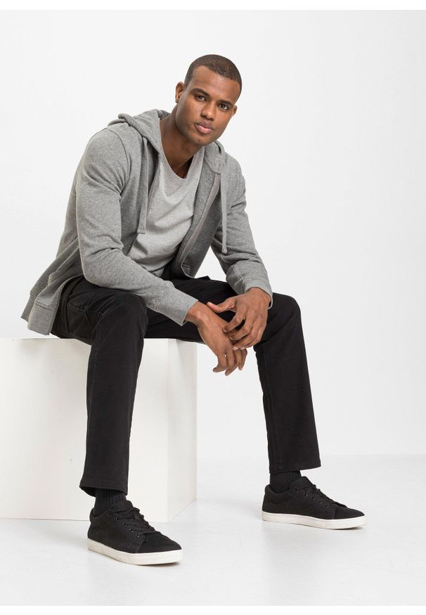 bonprix - Spodnie bojówki ze stretchem, o kroju slim fit, straight. Kolor: czarny