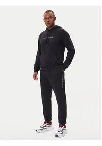 TOMMY HILFIGER - Tommy Hilfiger Spodnie dresowe UM0UM03664 Czarny Regular Fit. Kolor: czarny. Materiał: bawełna