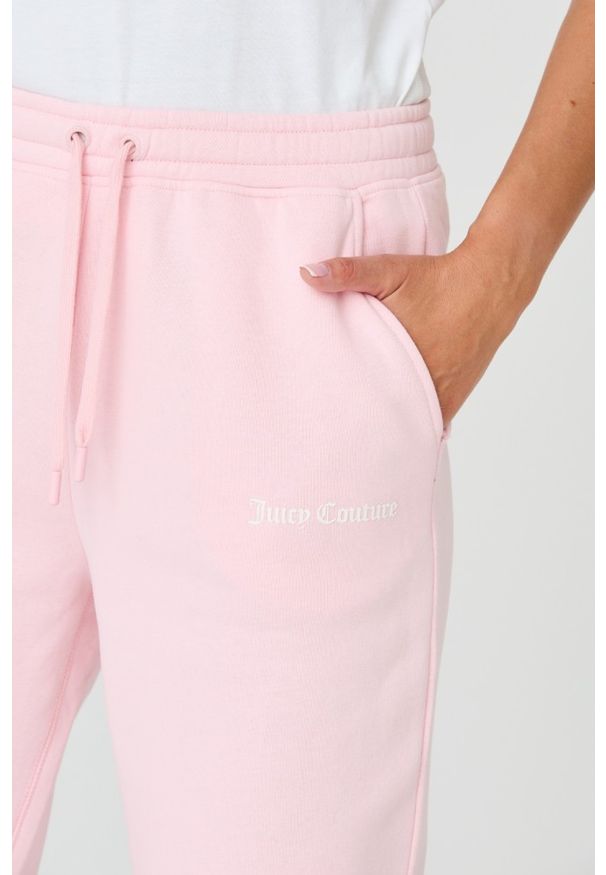 Juicy Couture - JUICY COUTURE Różowe damskie spodnie Sora, Rozmiar M. Kolor: różowy. Materiał: bawełna, guma