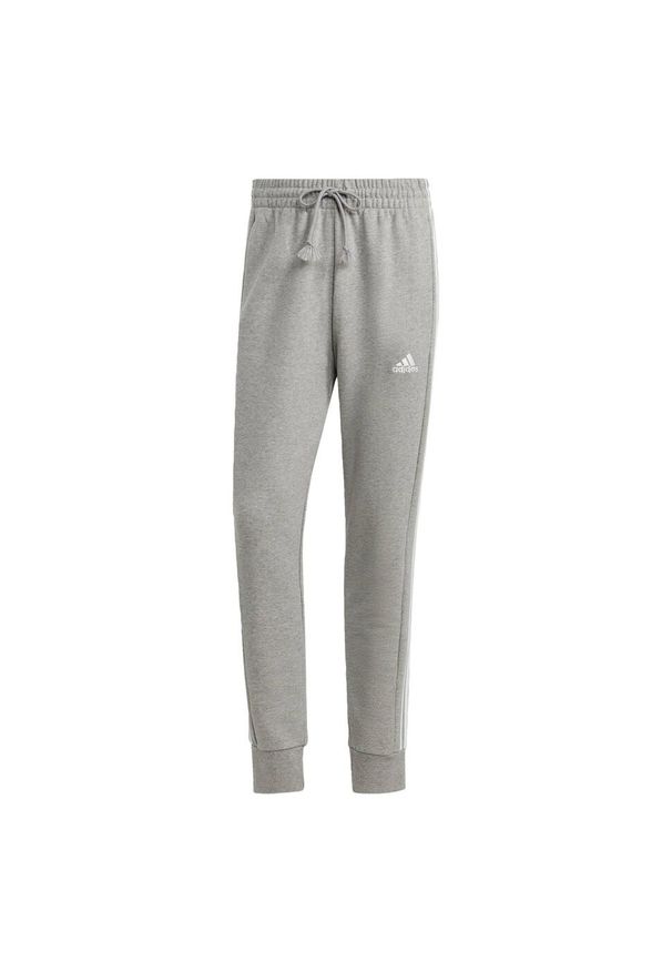 Adidas - Spodnie dresowe męskie adidas Essentials French Terry Tapered Cuff 3-Stripes. Kolor: biały, wielokolorowy, fioletowy, szary. Materiał: dresówka