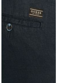 Guess Jeans - Spodnie. Kolor: niebieski. Materiał: bawełna, jeans, materiał, tkanina, len, poliester. Wzór: gładki #5