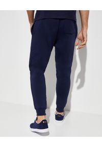 Ralph Lauren - RALPH LAUREN - Spodnie dresowe Jogger. Kolor: niebieski. Materiał: dresówka. Wzór: nadruk. Styl: sportowy #7