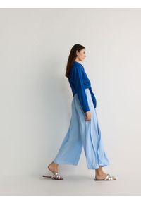 Reserved - Spodnie culotte - jasnoniebieski. Kolor: niebieski. Materiał: tkanina. Wzór: gładki