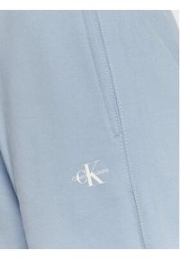Calvin Klein Jeans Spodnie dresowe J20J220261 Błękitny Relaxed Fit. Kolor: niebieski. Materiał: bawełna