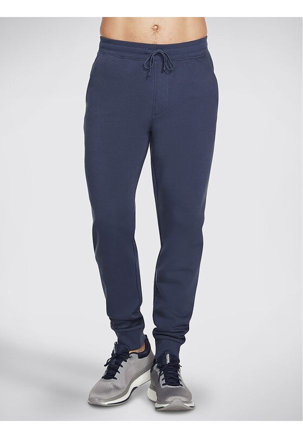 skechers - Skechers Spodnie dresowe Sweats Essential Jogger PT16 Szary Regular Fit. Kolor: szary. Materiał: bawełna, dresówka