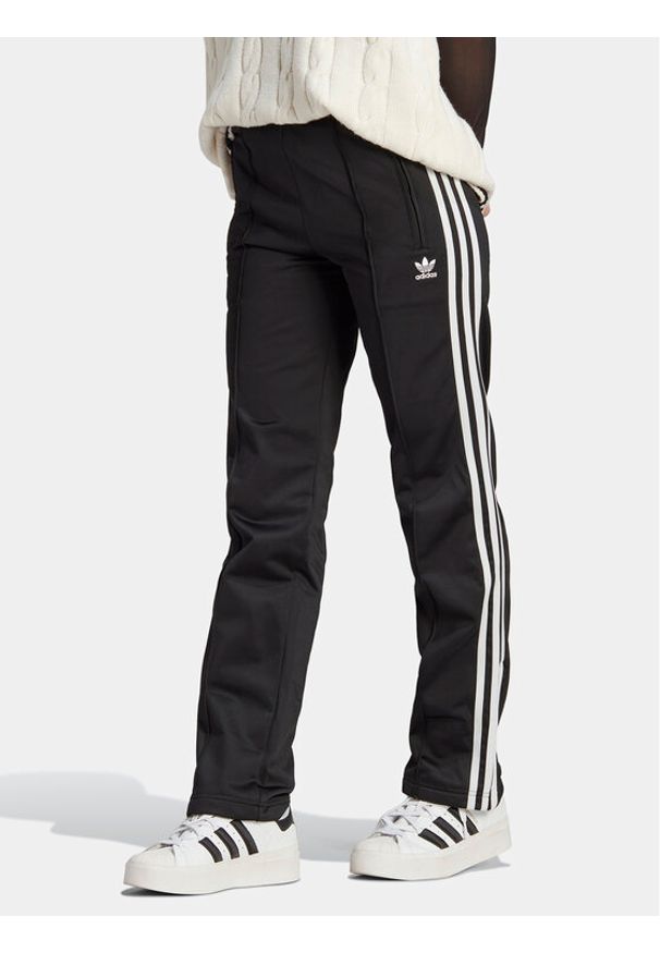 Adidas - adidas Spodnie dresowe adicolor Classics Firebird IL8763 Czarny Regular Fit. Kolor: czarny. Materiał: syntetyk